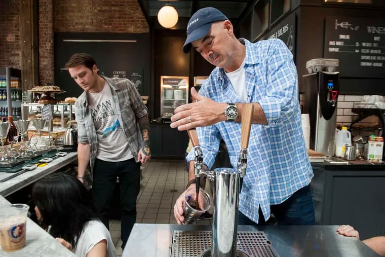 La Colombe cofounder Todd Carmichael pours a draft latte in Fishtown in 2018.