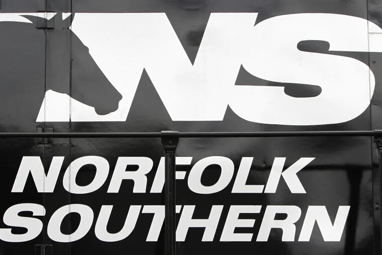 In this Jan. 19, 2011 photo, a Norfolk Southern logo is displayed on an engine in a rail yard in Hopewell, Va.