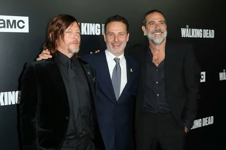 FILE - In this Sept. 27, 2018 file photo, from left to right, Norman Reedus, Andrew Lincoln and Jeffrey Dean Morgan arrive at the LA Premiere of Season 9 of their show "The Walking Dead"  in Los Angeles. The network behind the show that’s become synonymous with Georgia says it will “reevaluate” its activity in the state if a new abortion law goes into effect. The Walking Dead’s success has drawn steady streams of tourists to the Georgia towns where it has been filmed. A statement from AMC Networks calls the abortion legislation “highly restrictive” and says it will be closely watching what’s likely to be “a long and complicated fight” over the law. Georgia’s ban on virtually all abortions will take effect next year if it’s not blocked in the courts.