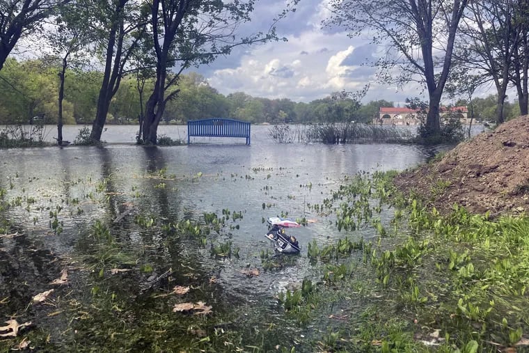 Flooding along the south shore of Edgewood Lake, looking north toward the boathouse at FDR Park in South Philadelphia. The flooding occured over the weekend into Monday, April 24, at the same time a contractor was carrying out a project to transform the park.