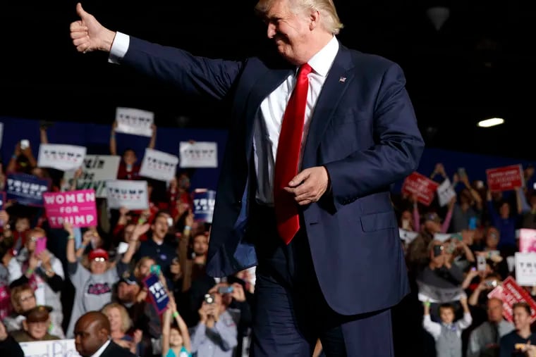 Donald Trump arrives at a rally in Geneva, Ohio. He hailed the news of the latest FBI probe, telling supporters at a New Hampshire rally that &quot;perhaps, finally, justice will be done.&quot;