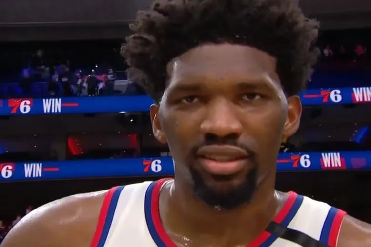 Sixers star Joel Embiid flashes TNT's Charles Barkley a look following Thursday night's overtime win against the Brooklyn Nets at the Wells Fargo Center.