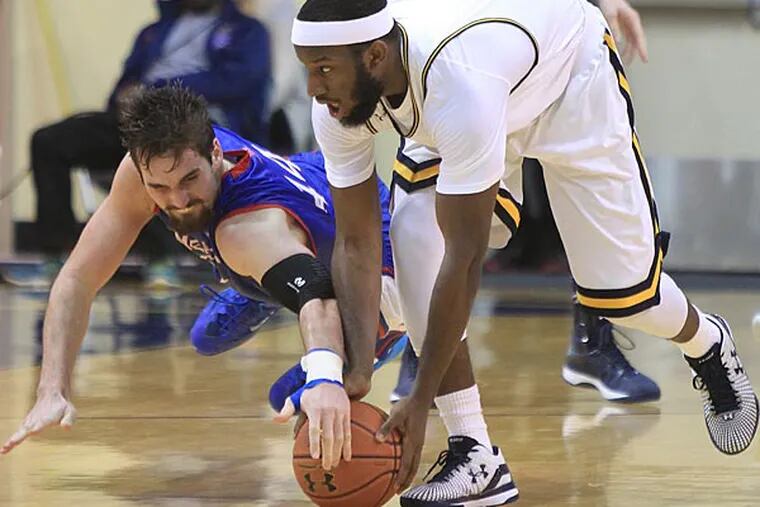 American's Zach Elcano (left) and La Salle's Jordan Price go after a loose ball. (Charles Fox/Staff Photographer)
