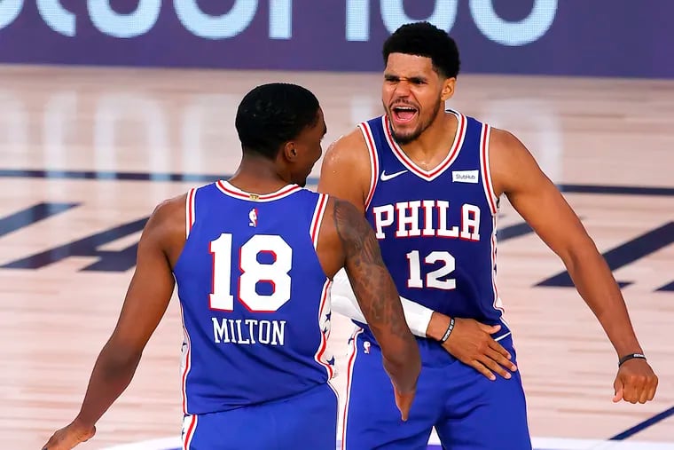 Shake Milton of the Sixers is congratulated by teammate Tobias Harris after his game-winning three-pointer on Monday night.