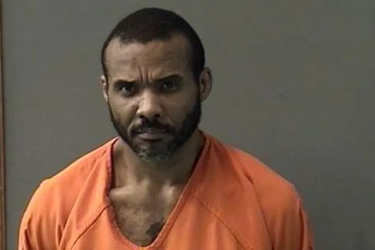 FILE - This undated booking photo released by Bell County Sheriff's Office shows Cedric Marks. The MMA fighter accused of killing two people before escaping from a private prison van says he had "nothing to do with" the bodies found buried in Oklahoma last month. (Bell County Sheriff's Office via AP, File)