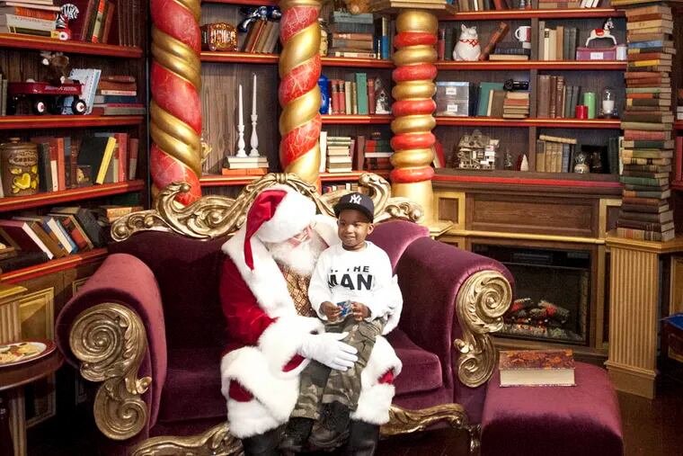 Anthony Sierra, 5, visits Santa in the 2,000-square-foot Dreamworks Santa holiday cottage at the Cherry Hill Mall. ( RON TARVER / Staff Photographer )