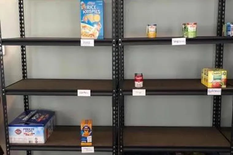 Almost bare shelves at the food pantry of The Angels Community Outreach of Pitman. The pantry had to close temporary this week because of lack of food.