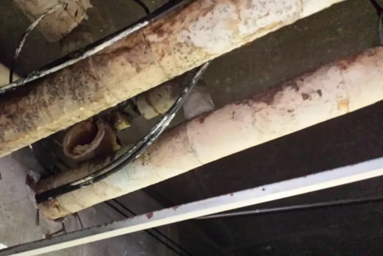Mold has been a longstanding problem at John B. Kelly Elementary School, where it is seen here on overhead pipes in 2015.