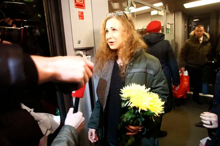 Maria Alekhina , a member of an activist punk band, leaves a train upon her arrival in Moscow. She was freed Monday in a surprising move by Russian President Vladimir Putin. DENIS TYRIN / Associated Press