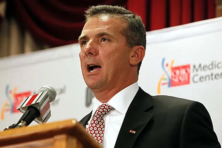 Urban Meyer was introduced yesterday as the new head football coach at Ohio State. (Terry Gilliam/AP)