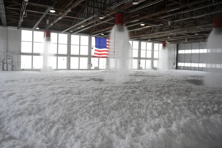 Firefighting foam fills Hangar 211 at Mountain Home Air Force Base, Idaho, Dec. 21, 2012. The Trump administration objects to a provision in a House defense spending bill that would require the military to phase out firefighting foam containing PFAS chemicals, which have tainted drinking water across the country, by 2025. Photo: U.S. Air Force.
