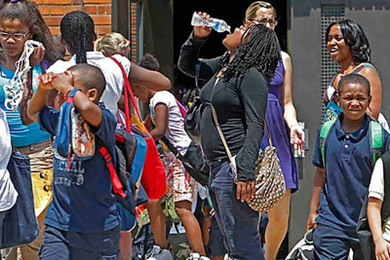 File photo: Students leave Spring Garden School in North Philadelphia in June. A school voucher bill is not about the students, says Inquirer columnist Karen Heller. (AKIRA SUWA / Staff Photographer)
