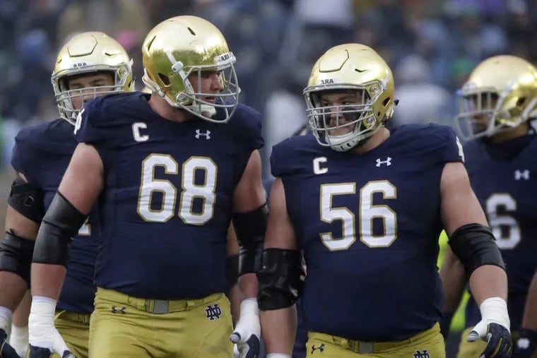Notre Dame offensive lineman Mike McGlinchey (left, with fellow first-round prospect Quenton Nelson) is a Penn Charter grad and a cousin of Falcons quarterback Matt Ryan.