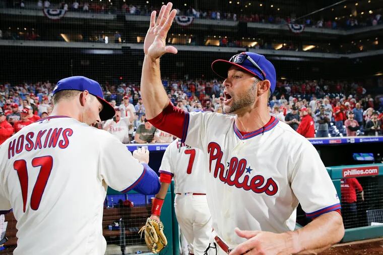 Gabe Kapler high-fived Rhys Hoskins after the Phillies beat the Atlanta Braves, 8-6, on March 30.