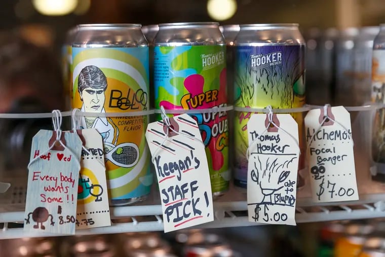 At the 320 Market at Swarthmore, PA, the staff of the bottleshop place notes on craft beers that inform their consumers about some of the beers in their large selection.