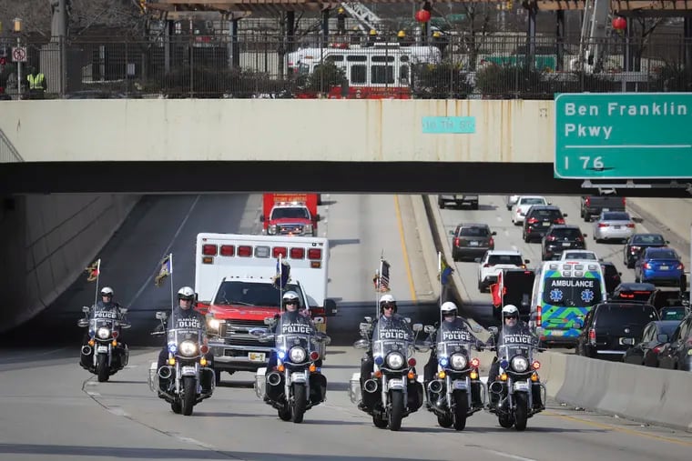A Philadelphia Fire Department medic unit is escorted along Interstate I-676 east through Philadelphia on Wednesday, March 20, 2019. Firefighter Michael Bernstein, a 22-year Fire Department veteran, died after he was taken to Mercy Fitzgerald Hospital in Darby.