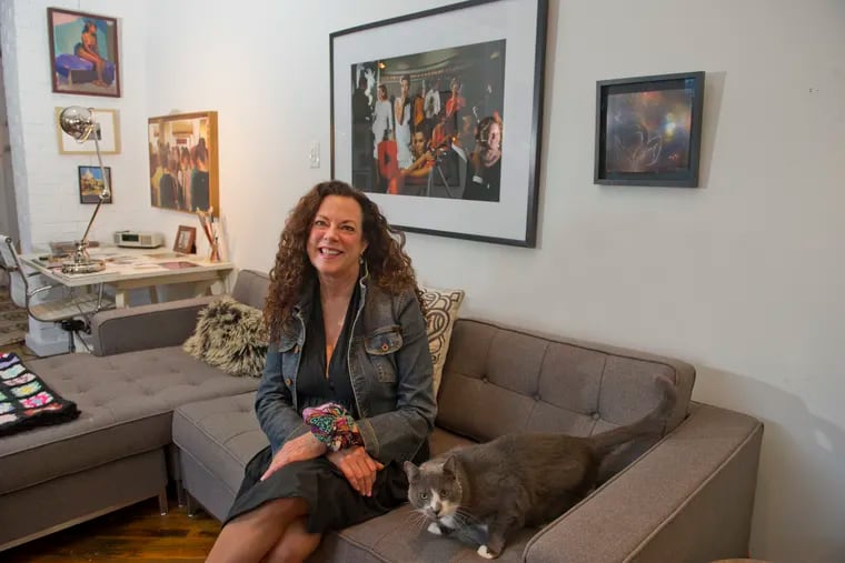 Art collector Terri Currier lives with her cat, Wally, in an old candy factory redeveloped by John Cunningham of the Birdnest Group.