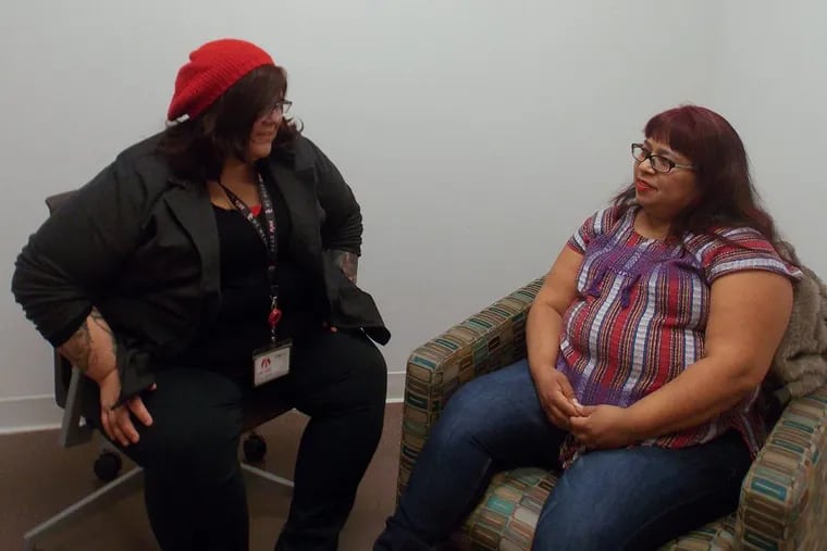 Fanny Ortiz (right), who left an abusive marriage after nearly a decade, meets weekly with therapist Brittany Martinez at the East Los Angeles Women’s Center. The office is located on the campus of the Los Angeles County-USC Medical Center.