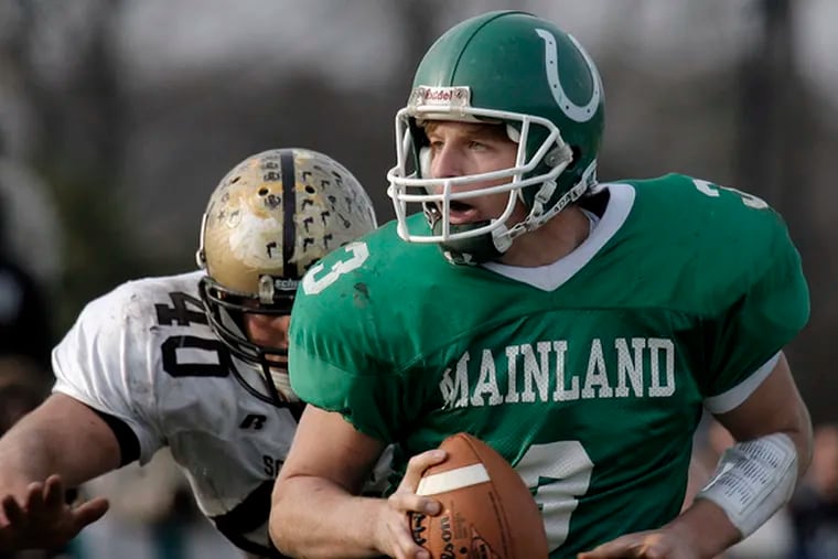 Mainland QB Brent Caprio looks for a receiver as Southern&#0039;s Glenn Carson closes in on him.
