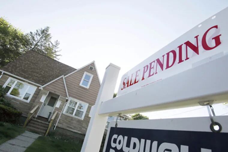 A positive sign in Framingham, Mass., this month. The housing market “has clearly turned the corner,” a leading Realtors economist said of the latest numbers. BILL SIKES / Associated Press