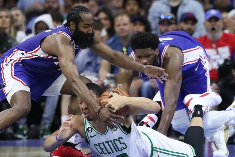 Sixers guard James Harden and center Joel Embiid reach for the basketball against Boston Celtics forward Grant Williams during the third quarter in Game 4 of the Eastern Conference semifinal playoffs on Sunday, May 7, 2023 in Philadelphia.