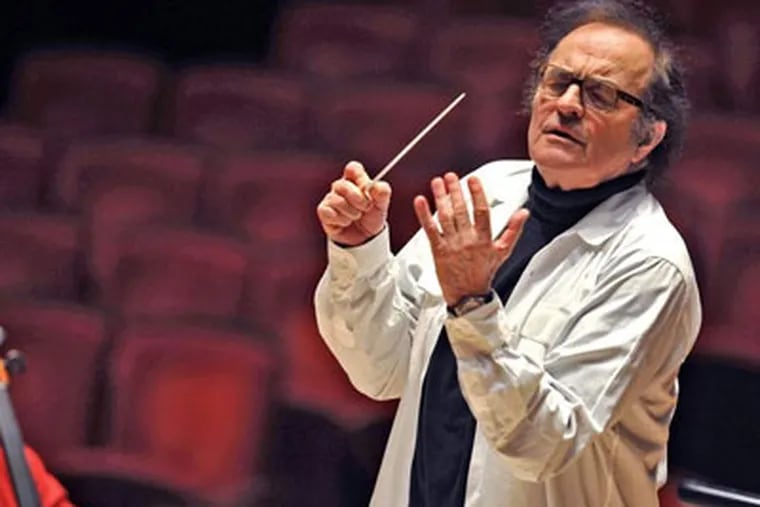 Conductor Charles Dutoit rehearses the Philadelphia Orchestra. He has filled various roles during his more than 30 years&rsquo; association with the orchestra &mdash; from podium guest to director of the orchestra&rsquo;s two summer seasons to his latest four years as chief conductor. (CLEM MURRAY / Staff Photographer)