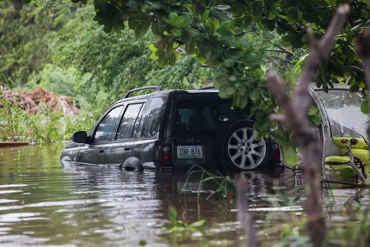 A vehicle is submerged after Hurricane Fiona in Salinas, Puerto Rico, Monday, Sept. 19, 2022.