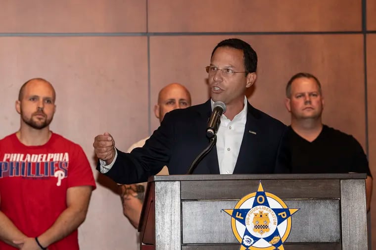 Josh Shapiro, Pennsylvania Attorney General speaks at the podium in support for wounded police officers last summer at the FOP Lodge in Philadelphia.