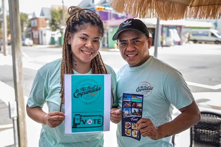 Owners of Rincón Catracho Siara Zuniga and Alexis Cano pose for a portrait in front of their restaurant  in Atlantic City, N.J., on Thursday, Aug., 20, 2020. The two owners are among the 10 restaurants in Atlantic City competing in the month long empanada challenge.