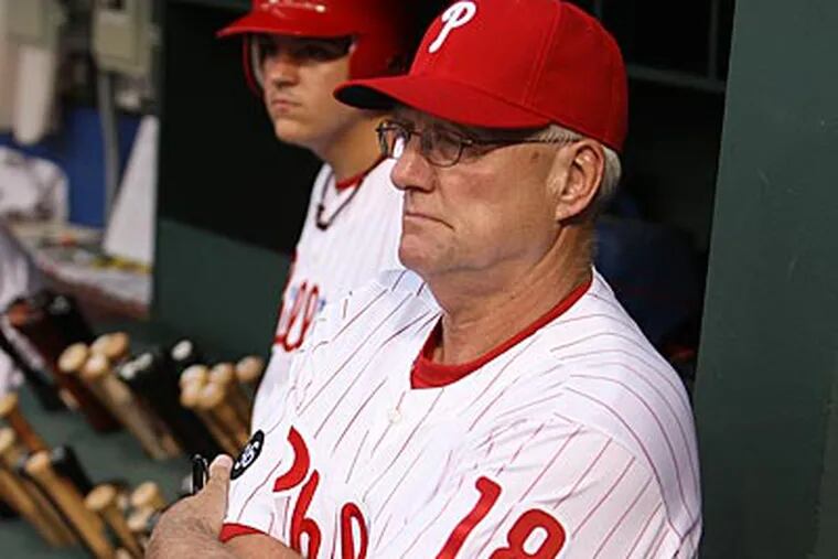 Phillies' new batting coach Greg Gross watches team from dugout. (Steven M. Falk / Staff Photographer)