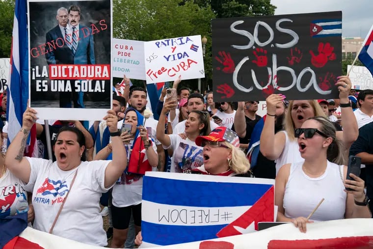 Demonstrators shout their solidarity with the Cuban people against the communist government during a rally outside the White House in Washington, Saturday, July 17, 2021.