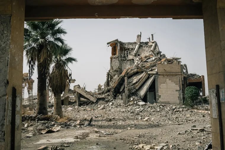 A hotel destroyed by an airstrike in Raqqa, Syria is left in rubble. A year after the ejection of the Islamic State, the city is still in ruins, on Oct. 14, 2018.
