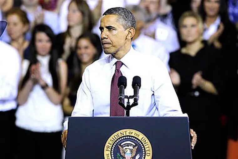 President Barack Obama pauses while speaking at Scranton High School, Wednesday, Nov. 30, 2011 in Scranton, Pa. (AP Photo / Alex Brandon)