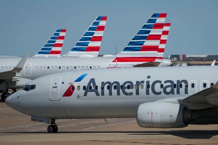 American Airlines planes are photographed at the gates of Terminal C at Dallas/Fort Worth International Airport.