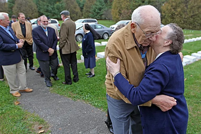 Sister Maria Consuelo embraces Medal of Honor recipient Hector A. Cafferata Jr., who with five other medal recipients laid a wreath Saturday at Sister Maria Veronica Keane’s grave. She served as a volunteer archivist at the Freedoms Foundation of Valley Forge for 17 years after she retired. (Michael Bryant / Staff Photographer)