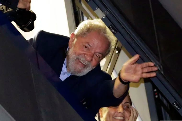 FILE - In this April 5, 2018 file photo, Brazil's former President Luiz Inacio Lula da Silva waves to supporters, in Sao Bernardo do Campo, Brazil.  Lawyers representing the former leader say they have applied for his release following a legal ruling from a Supreme Court judge. Judge Marco Aurelio ruled Wednesday that individuals who have been convicted, but are at early stage of appeals, should be set free. The judge's decision would apply to da Silva who has been in prison since April and is appealing a conviction for corruption that led to a sentence of just over 12 years in prison.  (AP Photo/Nelson Antoine, File)