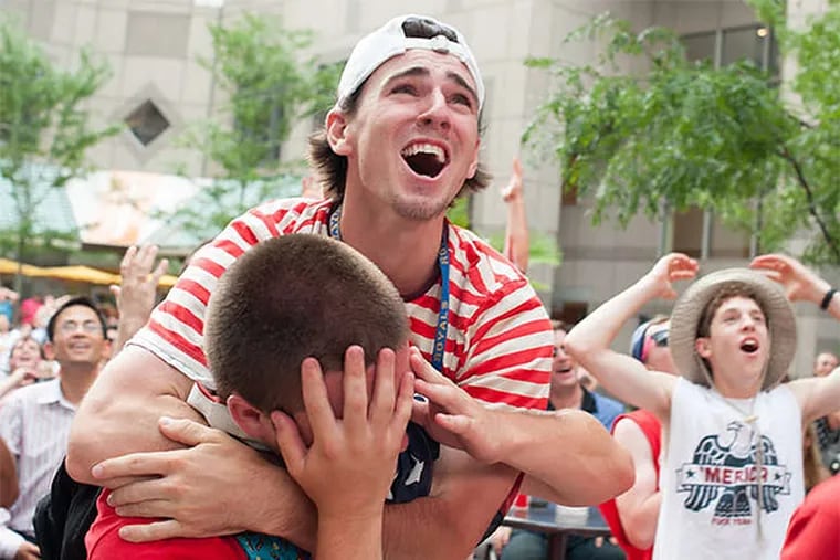 Fans react to a missed scoring opportunity for Team USA while watching the World Cup match against Belgium at Commerce Square. Some were longtime soccer fans; others were newcomers. And still others just like a party. (Matthew Hall/Staff Photographer)