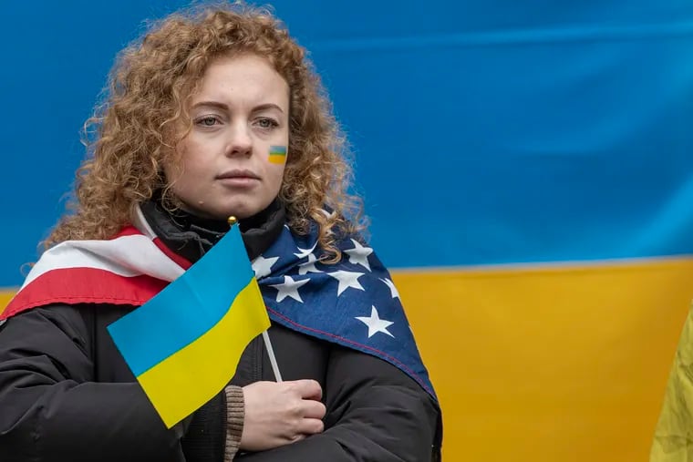 Daria Tolpyhina, a member of the Philadelphia region's Ukrainian community, protests against the Russian invasion during a rally at Philadelphia City Hall on Feb 25, 2022