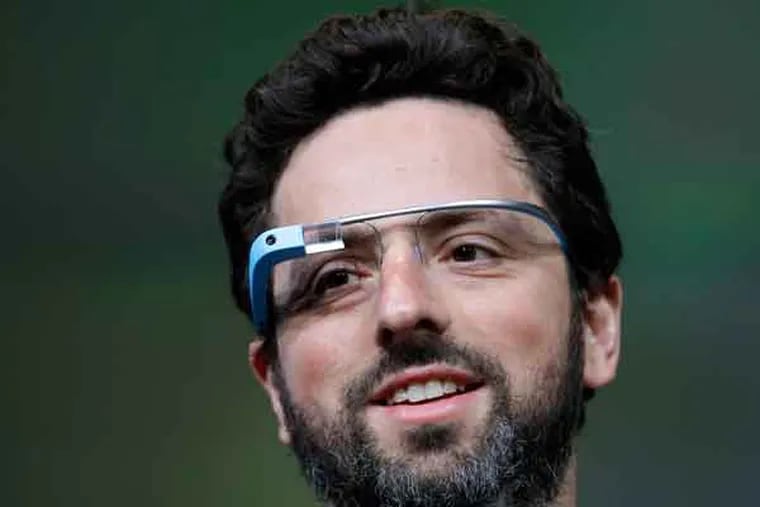 FILE - This June 27, 2012 file photo shows Google co-founder Sergey Brin demonstrating Google's new Glass, wearable internet glasses, at the Google I/O conference in San Francisco. Google is starting to notify 8,000 people who will be invited to buy a test version of the company’s much-anticipated Internet-connected glasses for $1,500. The invitations are being sent to the winners of a contest conducted a month ago. Google asked U.S. residents to submit applications through Twitter or its Plus service to explain in 50 words or less how they would use a technology that is being hailed as the next breakthrough in mobile computing. (AP Photo/Paul Sakuma, file)