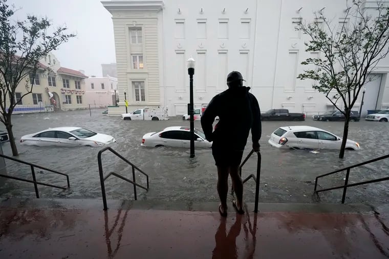 Floodwaters move on the street, Wednesday, Sept. 16, 2020, in Pensacola, Fla.  The Census Bureau is contending with several natural disasters as wildfires and hurricanes disrupt the final weeks of the nation’s once-a-decade headcount.
