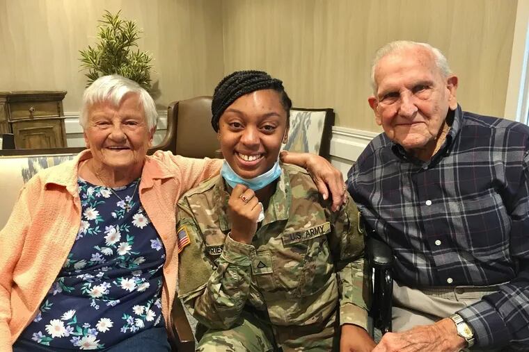 Delores Grasberger, 93, with her husband and Dashauna Priest (middle). The Grasbergers say they consider Priest to be a third daughter to them.