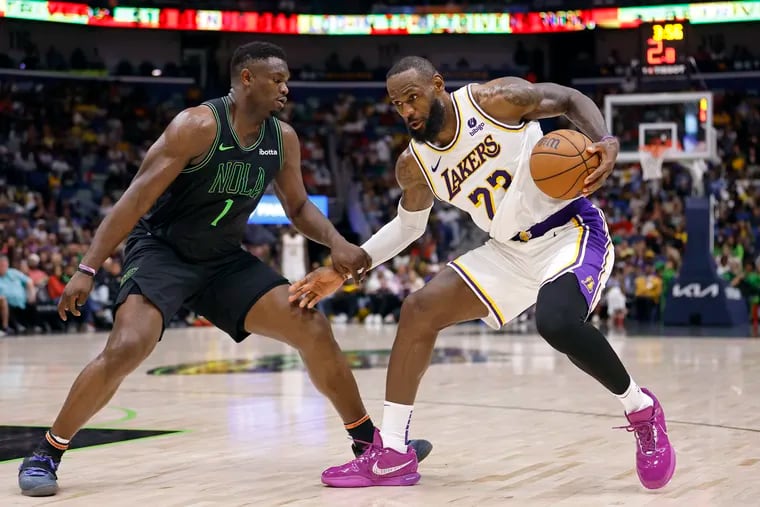 Zion Williamson #1 of the New Orleans Pelicans defends against LeBron James #23 of the Los Angeles Lakers at Smoothie King Center on April 14, 2024 in New Orleans, Louisiana.