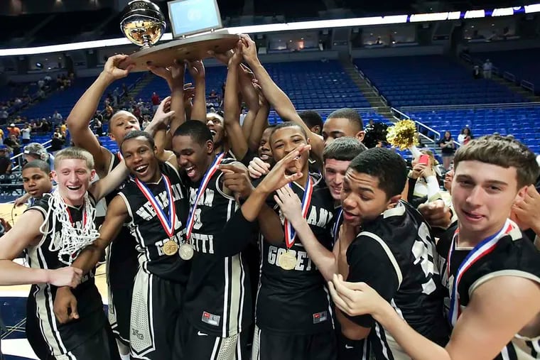 Neumann-Goretti celebrates beating Montour for the PIAA Class 3A state basketball championship in State College on March 23, 2012.