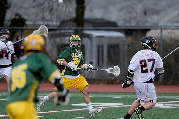 Clearview Regional midfielder Matt Donnelly (center) in first
half action against Haddonfield on opening day of the South Jersey
lacrosse season, March 25, 2015.  (Tom Gralish/Staff Photographer)