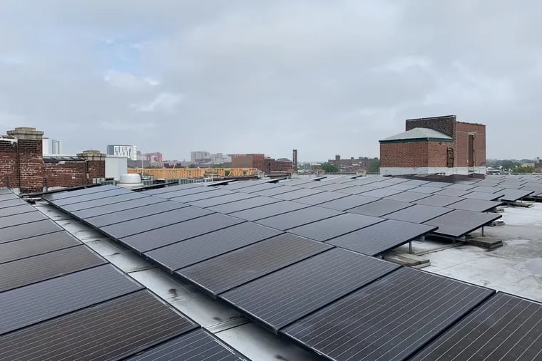 The roof of the Crane Arts Building, in North Philadelphia, is covered in 82 kilowatts of solar panels. Under a new city program signed into law Wednesday by Mayor Kenney, a similar commercial solar system would receive a rebate from the city of $8,200.