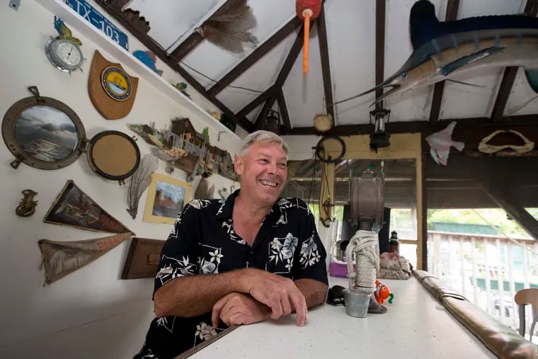 Tom Lamb's bar, located in the pool house, is decorated with souvenirs from his nautical past and items he has gathered as operator of a salvage company.