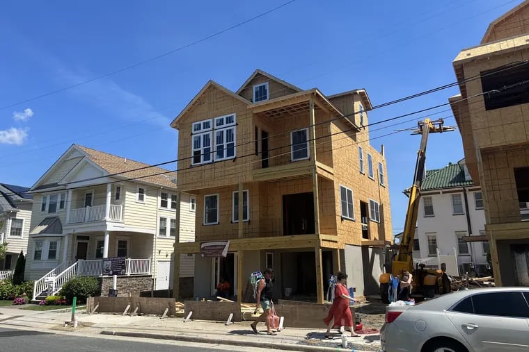 A three-story house at 19 S. Knight Ave. in Margate rises above its neighbors. Builders obtained variances for front yard setback and a  third-floor deck to construct the home. Realtors urged possible buyers to "Do New" in a sign. It's listed for $2.79 million.