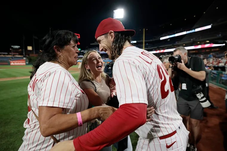 Michael Lorenzen is greeted by his mother, Cheryl Lorenzen (left), wife, Cassi Lorenzen, and 9-month-old daughter, June Lorenzen, after he threw a no-hitter in his Phillies debut on Wednesday.