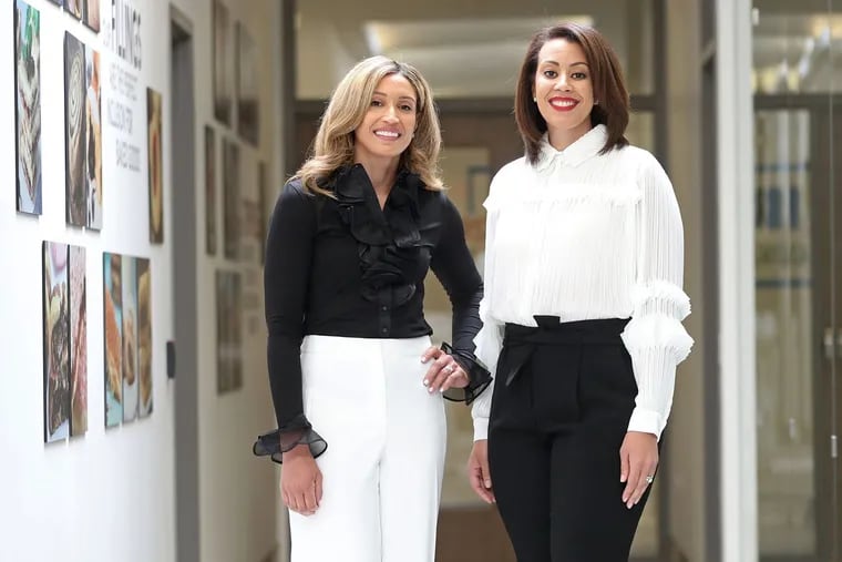 Siblings Erin Tolefree (left) and Cara Hughes of Baldwin Richardson Foods at the company's innovation center. They grew up helping to test Johnson hair products.