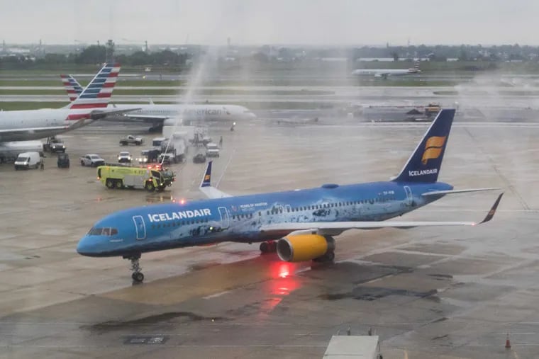 Icelandair’s inaugural flight to Philadelphia arrived at 7:15 p.m. Tuesday May 30, 2017.   In honor of Icelandair’s 80th anniversary, the plane exterior is painted as a glacier -- Vatnajokul, the largest glacier in Europe which tumbles down Iceland’s highest mountain ridge.  As with all new air service at PHL, fire trucks hose the plane with a water cannon salute as it arrives.